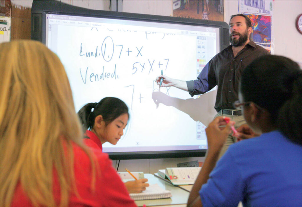 A french immersion teacher in class with sudents
