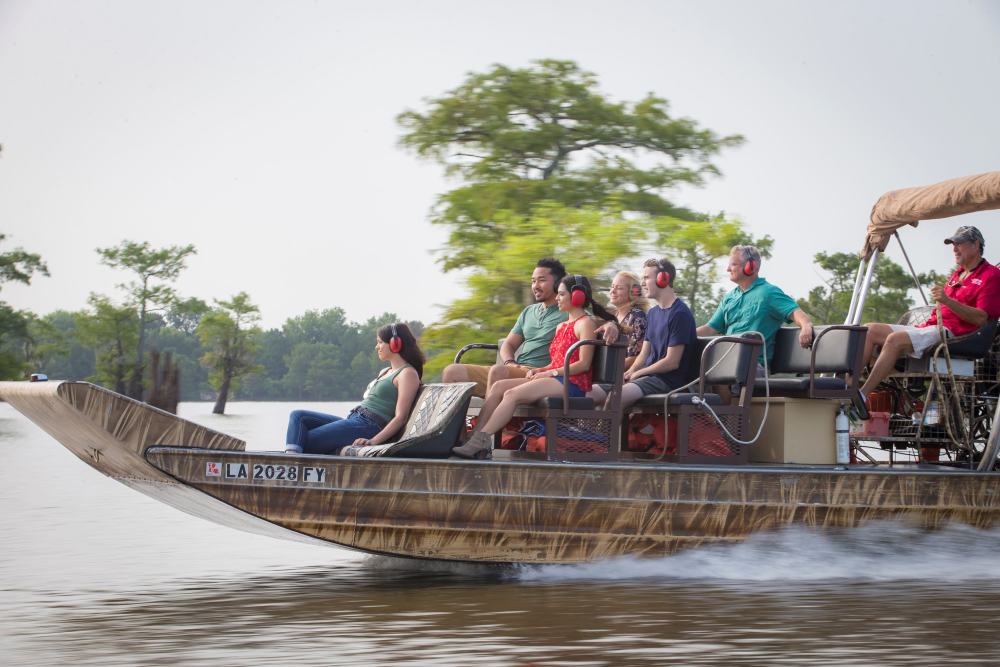 Tourists on an air boat in the swamp