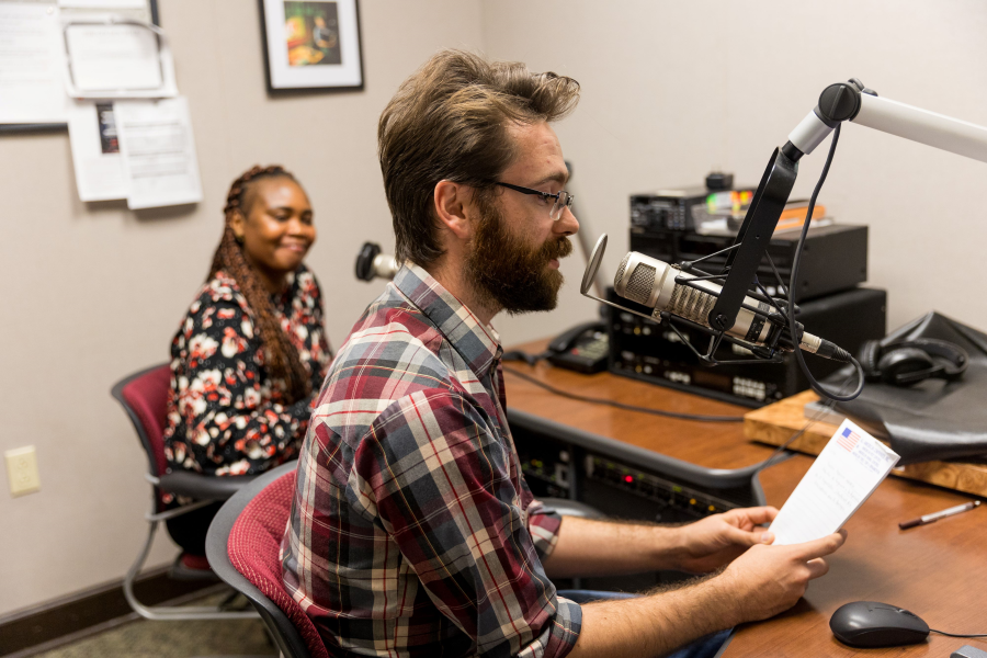 Colby LeJeune announcing on the radio program Bonjour Louisiane