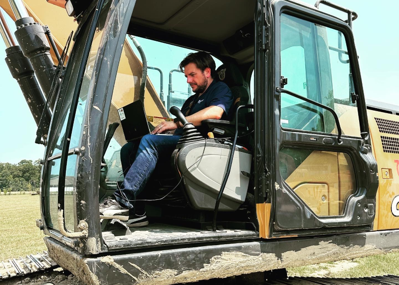 Luc Soleau on a tractor, who owns The Soleau Group