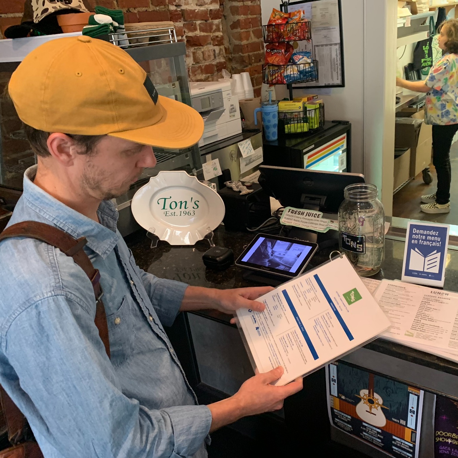 A man reading French menus